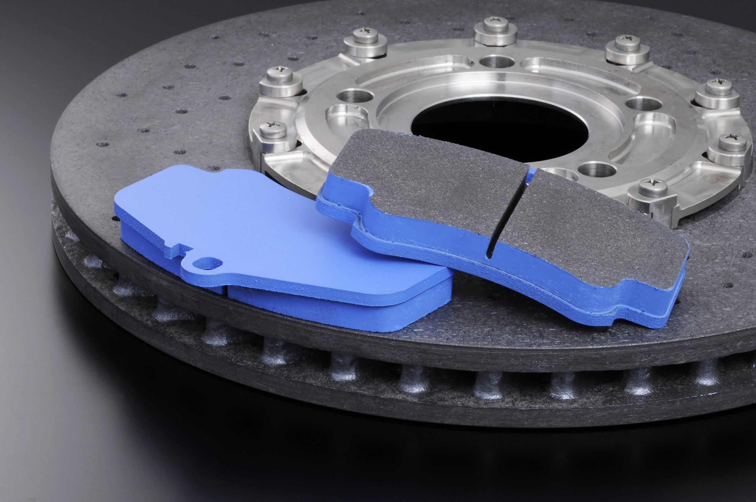 Brake pads for a ceramic brake assembly